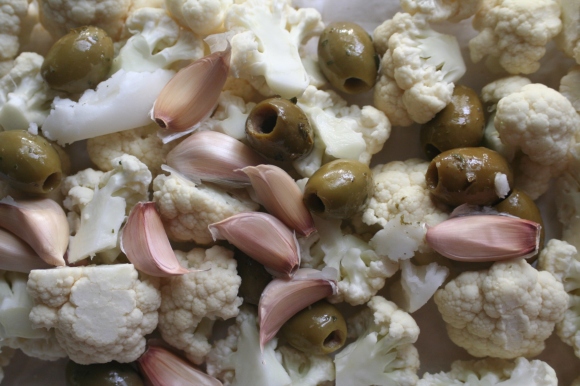 Roasted cauliflower with garlic, olives, and harissa cream. https://theselfcateredwedding.wordpress.com/